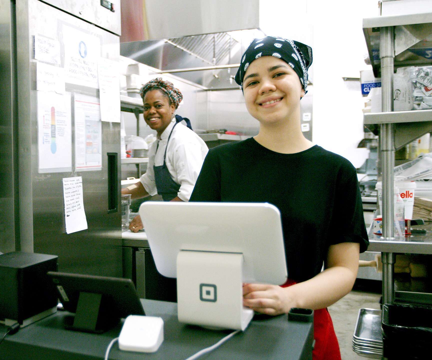 Maker Kitchen tenant at register in a commercial kitchen space